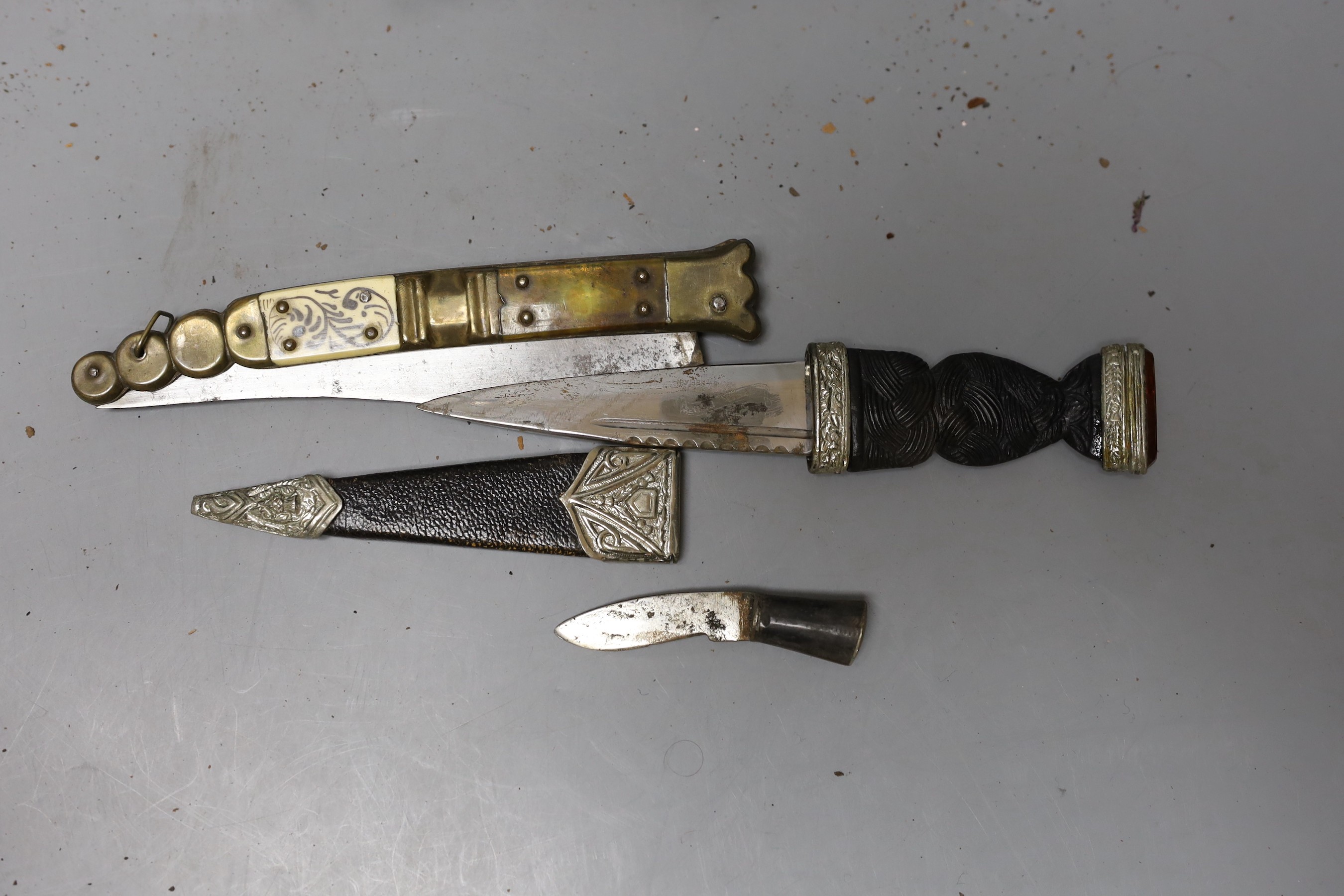 A group of knives and kukri and skean